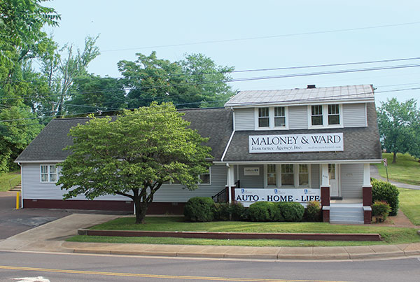 Maloney & Ward Insurance Agency building with signs